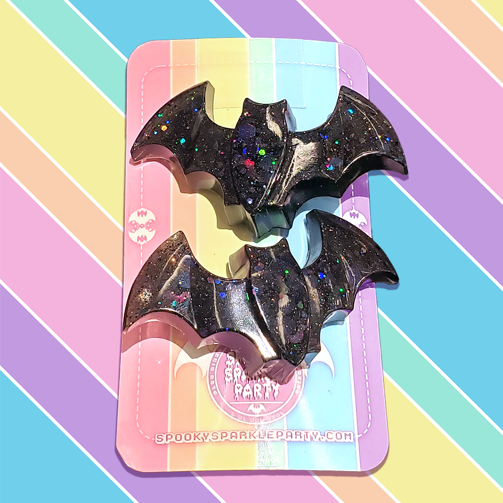 One pair black bat clips