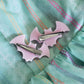 One pair pink bat clips